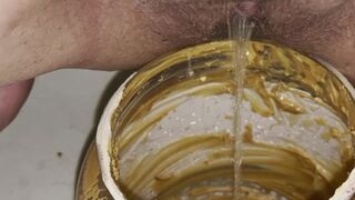 Girl pisses in 5lb jar of peanut butter